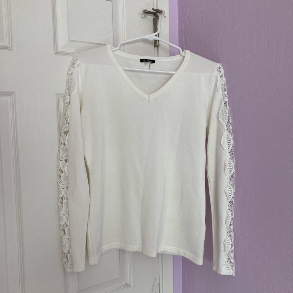 Vila Milano white long sleeved with cut out embroidery on sleeves.
